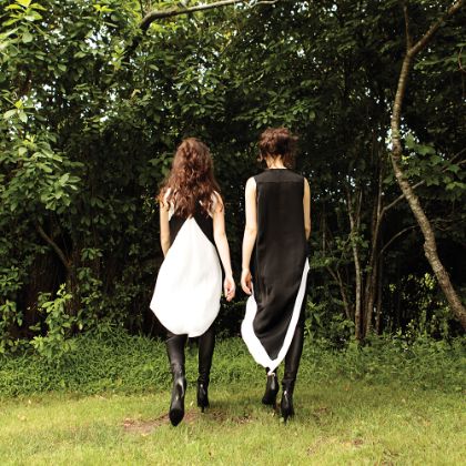 https://www.steinway.com/news/features/Naughton-Sisters-Playing-Double